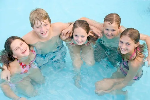 Children enjoying a pool with an automatic cover
