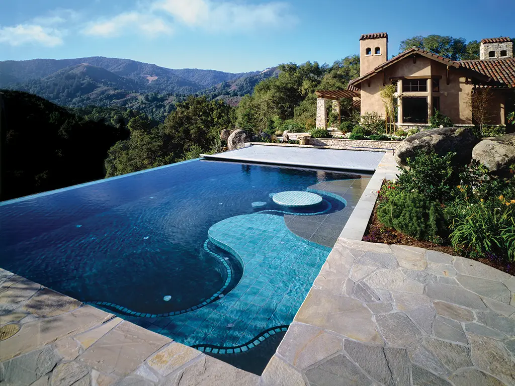 Infinity pool with automatic cover and mountain view