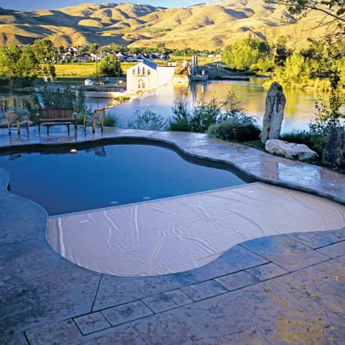 Automatic pool cover on a residential pool